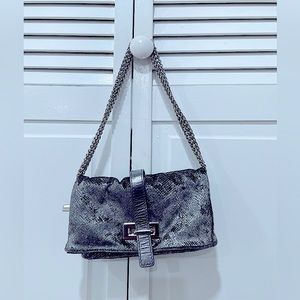 A velvet grey with silver shine crossbag.